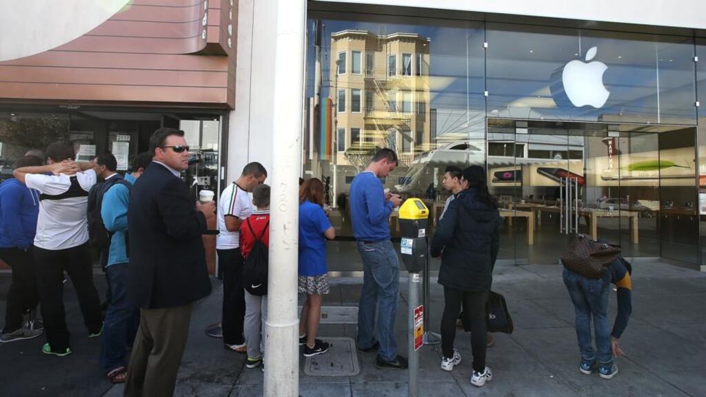 Customers line up in front of an Apple Store to purchase the new iPhone 6 in San Francisco. photograph: justin sullivan/getty images
