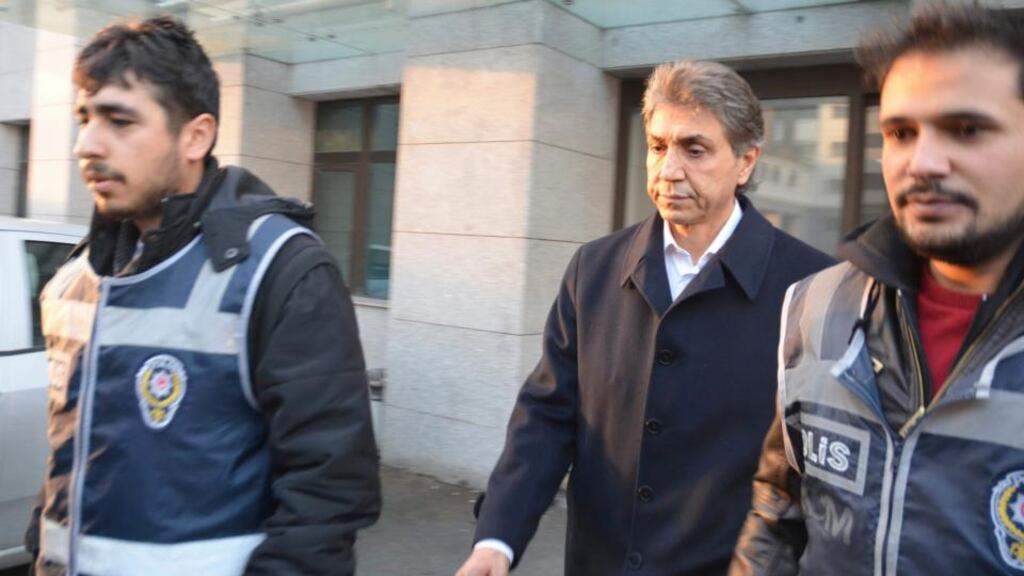 Mustafa Demir (centre), mayor of Istanbul’s Fatih district, is escorted by police officers as he leaves the police headquarters for a medical check-up in Istanbul. Five Turkish police commissioners were sacked a day after the sons of cabinet ministers and prominent businessmen close to Prime Minister Tayyip Erdogan were detained in a corruption investigation, a local news agency said today. Photograph: Stringer/Reuters