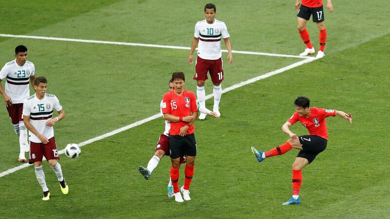 Son Heung-min curls in what proved to be a late consolation for Mexico against South Korea. Photograph: Darren Staples/Reuters