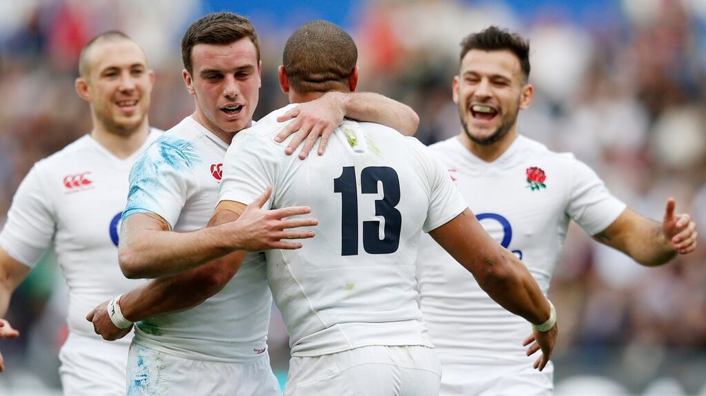 England’s Jonathan Joseph celebrates with George Ford and Danny Care after his third try. Photograph: Paul Childs/Reuters