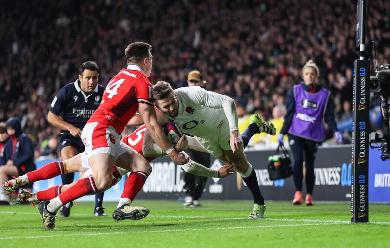England's Elliot Daly scores the decisive try at Twickenham despite the efforts of Wales duo Josh Adams and Cameron Winnett. Photograph: Billy Stickland/Inpho