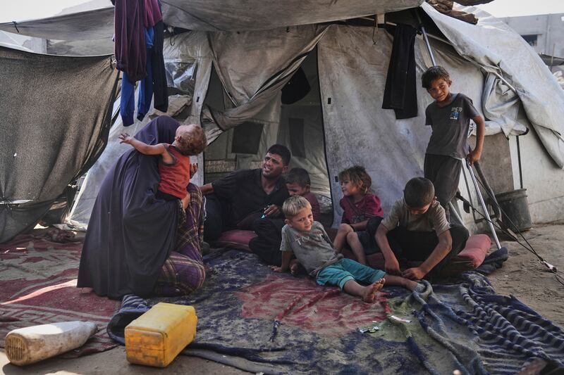 Abeer and Fadi Sobh with their children at a camp for displaced Palestinians in Gaza City. Photograph: Jehad Alshrafi/AP