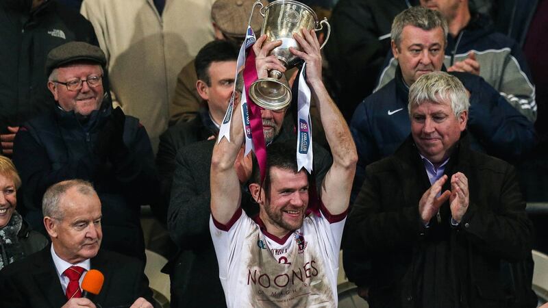 Francis McEldowney lifts the cup after Slaughtneil’s win over Kilcoo in the Ulster senior club football final. Photograph: Presseye/Inpho