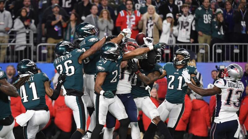 On the final play of the game, Rob Gronkowski of the New England Patriots, swarmed by the Philadelphia Eagles, fails to catch a pass from Tom Brady. Photograph: Getty Images