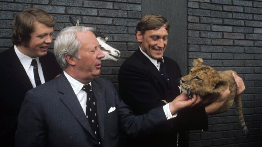 Lions captain Willie John McBride (right) looks on as then leader of the opposition Edward Heath strokes lion cub “Fiji”, given to the Lions on their arrival at Heathrow after the famous (and infamous) tour to South Africa in 1974.