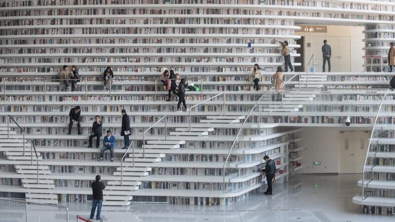 Tianjin Binhai Library: Why set stories in far-off worlds? As soon as you start writing a story set in contemporary Ireland, near-future America or 18th-century Japan, prior associations and prejudices come rushing in and the wider message may be lost. Photograph: Fred Dufour/AFP