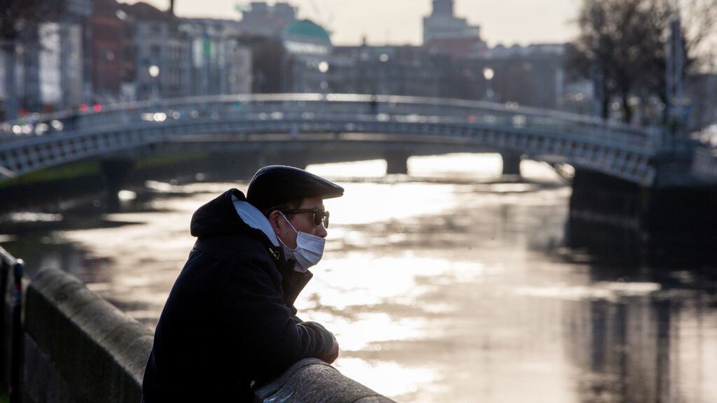 A view of a man wearing a mask on O’Connell Bridge in Dublin. Photograph: Tom Honan/The Irish Times