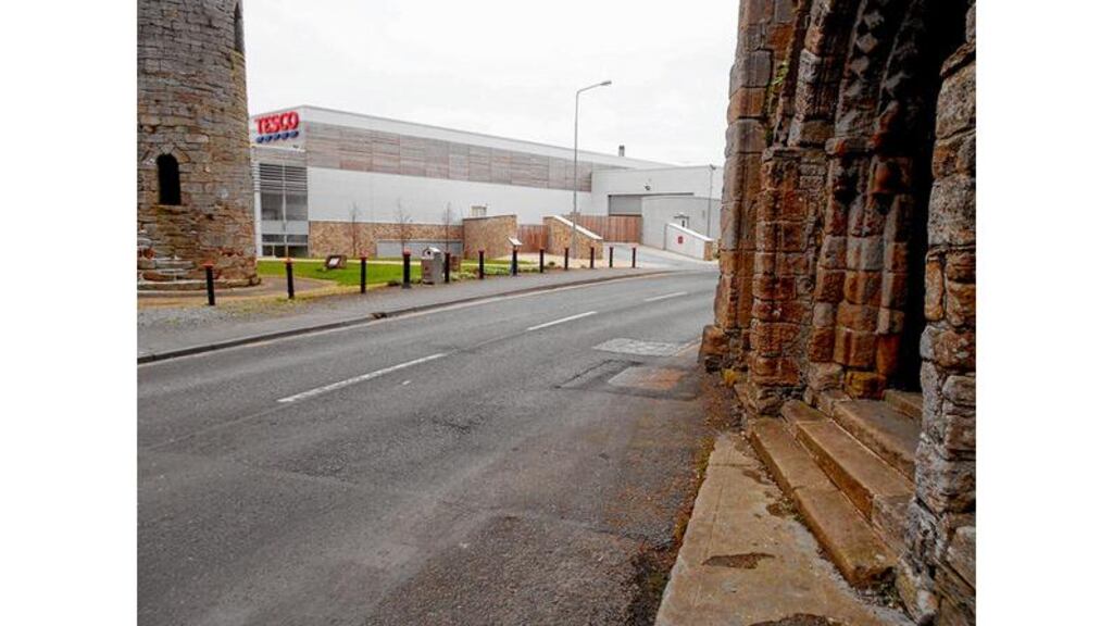 Tesco in Roscrea, Co Tipperary, near the round tower and Romanesque arch of St Cronan's Abbey, fails to take account of its historical setting. PHOTOGRAPHS: PETER COOK AND PETER MADDEN
