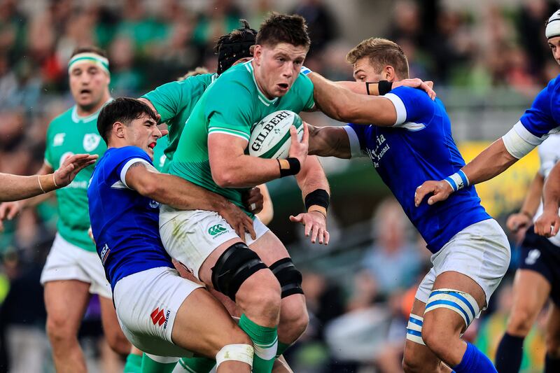 Ireland's Joe McCarthy runs into traffic during the match against Italy. Photograph: Evan Treacy/Inpho