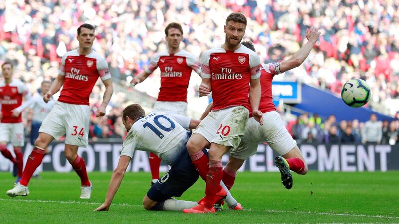 Arsenal’s Shkodran Mustafi fouls Tottenham’s Harry Kane to give away a penalty. Photo: Andrew Couldridge/Reuters