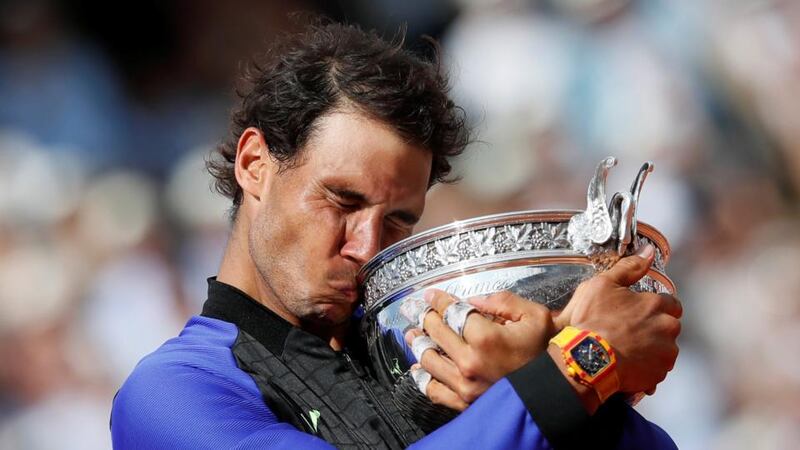 Spain’s Rafael Nadal celebrates with the trophy after winning the French Open final against Switzerland’s Stan Wawrinka at Roland Garros. Photograph: Christian Hartmann/Reuters