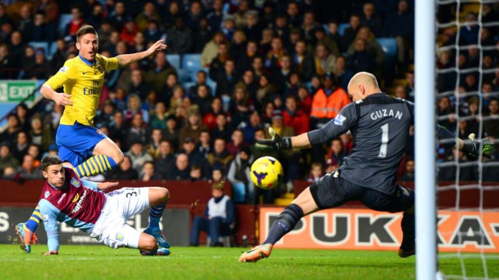 Olivier Giroud shoots past Aston Villa goalkeeper Brad Guzan to score Arsenal’s second goal at Villa Park last night. Photograph: Michael Regan/Getty Images