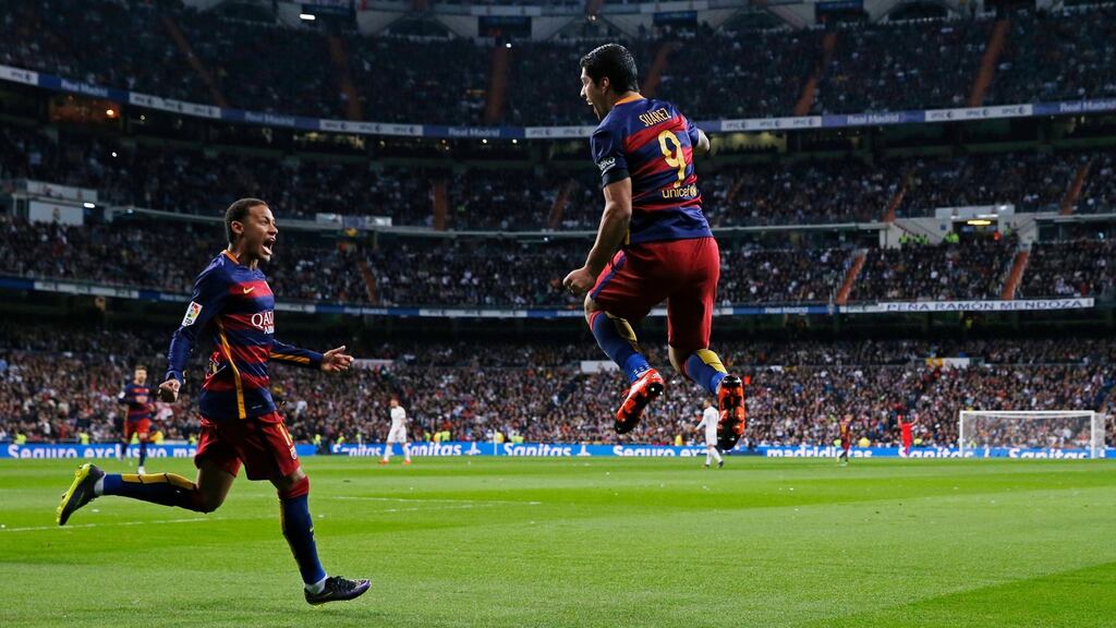 Luis Suarez celebrates after opening the scoring for Barcelona against Real Madrid in the Spanish Primera Division game at the Santiago Bernabeu in Madrid. Photograph: Juan Medina/Reuters/Livepic