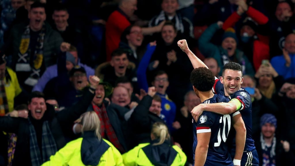 Scotland’s Che Adams and John McGinn celebrate a goal during their win over Denmark. Photo: Robert Perry