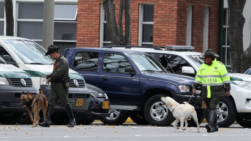 Police personnel inspect the surroundings of where a car bomb exploded at the Santander General Police School. Photograph: EPA/Mauricio Duenas Castaneda
