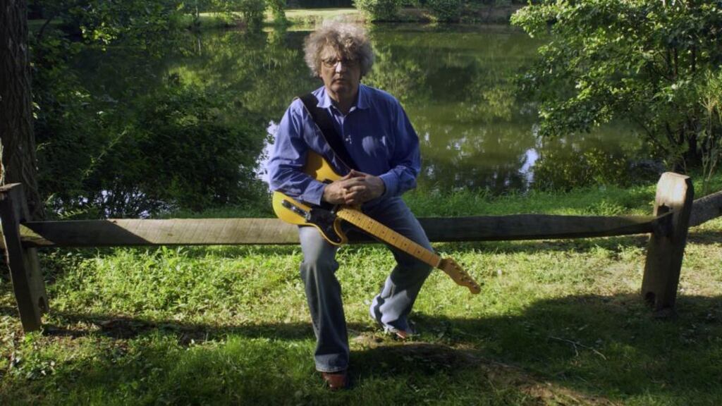 Paul Muldoon with his guitar in Princeton, New Jersey, in 2007. Photograph: Oliver Morris/Getty Images
