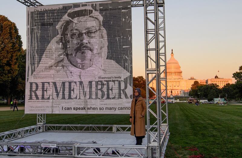 Turkish writer Hatice Cengiz (right), fiancee of Saudi journalist and dissident Jamal Khashoggi, poses next to a portrait of Khashoggi after unveiling it in Washington, DC in 2021., on the third anniversary of his murder at the Saudi consulate in Istanbul. Photograph: Nicholas Kamm//AFP via Getty Images