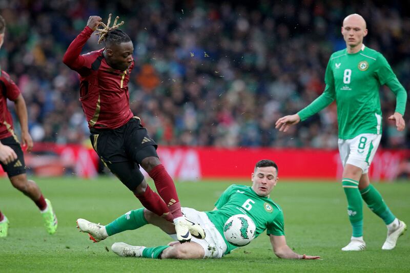 Belgium's Jeremy Doku (L) vies with Republic of Ireland's midfielder Josh Cullen. Photograph: Paul Faith/AFP via Getty