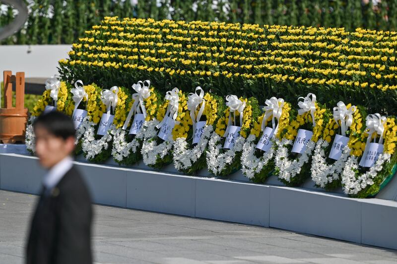 A line of floral wreaths is pictured after being placed there by officials during the ceremony to mark the 80th anniversary of the world's first atomic bomb attack, in the city of Hiroshima. Photograph: RICHARD A. BROOKS/AFP via Getty Images