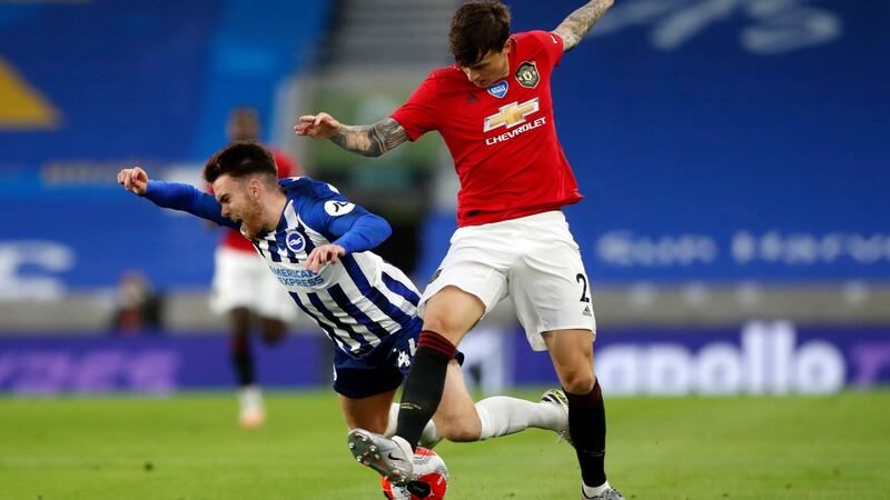 Ireland striker Aaron Connolly is tackled by Victor Lindelof. Photograph: Alastair Grant/PA