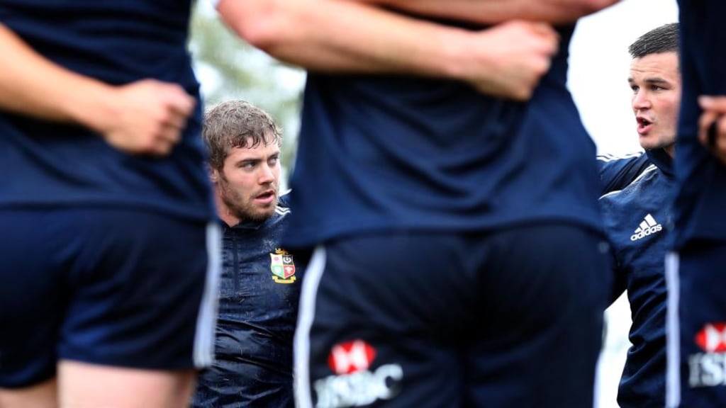 Lions Test fullback Leigh Halfpenny appears to listen intently as outhalf Jonny Sexton speaks during the captain’s run out at Churchie School in Brisbane. Photograph: Dan Sheridan/Inpho