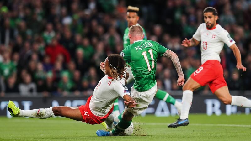 James McClean has a shot blocked by Kevin Mbabu. Photo: Ryan Byrne/Inpho