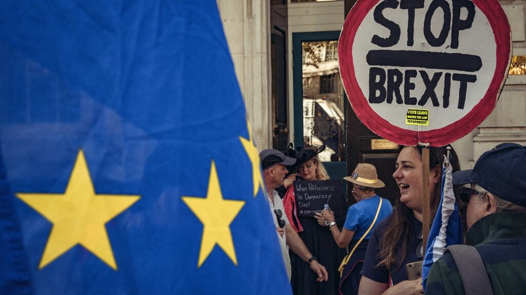 Demonstrators outside the cabinet office in London on Friday. Former prime minister John Major has announced that he will join one of several legal actions to block Boris Johnson’s move to suspend parliament. Photograph: Tom Jamieson/New York Times