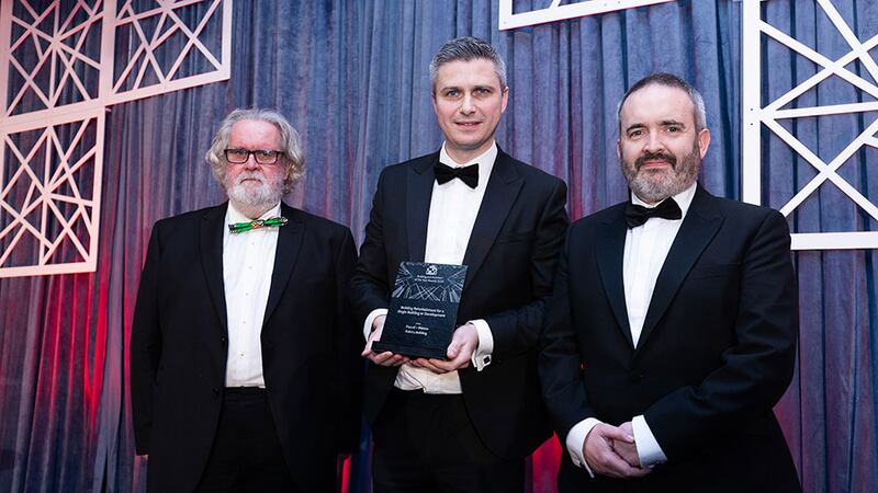 Derry Kearney, managing director Ireland & partner, Cundall, presents the building refurbishment for a single building or development to Seamus McMorris and Peter Cox, Pascall + Watson