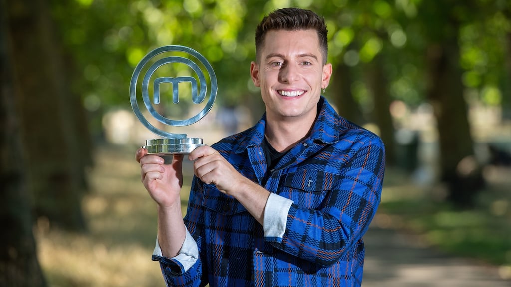 Riyadh Khalaf celebrates with the Celebrity MasterChef trophy. Photograph: Dominic Lipinski/PA