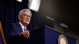 US officials dial back rate forecasts, signal just one cut this year
