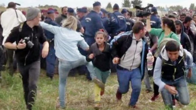 Camerawoman plans to sue refugee she was filmed kicking