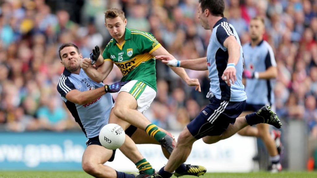 Kerry’s James O’Donoghue scores his side’s opening goal despite Dublin’s Kevin O’Brien and Michael Darragh MacAuley in the last year’s All-Ireland semi-final at Croke Park. Photograph: James Crombie/Inpho