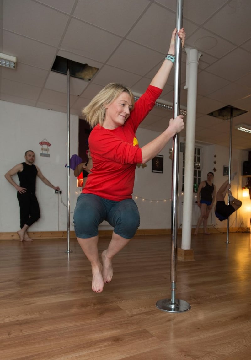 Fiona had been dying to swing around the pole since she set foot in the studio and was not left disappointed. Photograph: Dave Meehan/The Irish Times