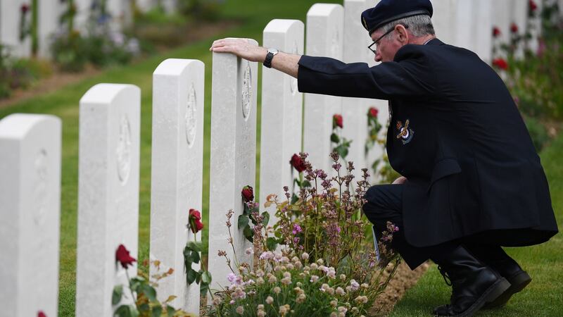 A veteran views graves ahead of a remembrance ceremony at the Commonwealth War Graves Cemetery at Bayeux, France. Photograph: Neil Hall/EPA