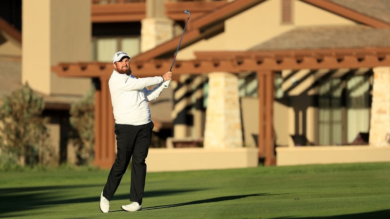 Lowry plays his approach to the first at Pebble Beach. Photo: Mike Ehrmann/Getty Images