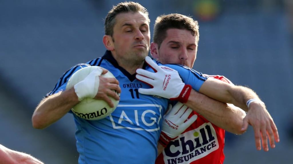 Alan Brogan of Dublin with Daniel Goulding of Cork in Croke Park. Photograph: Donall Farmer / Inpho