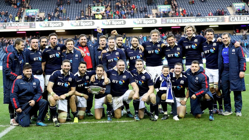 The Scotland team celebrate with the Quaich trophy. Photograph: Dan Sheridan/Inpho