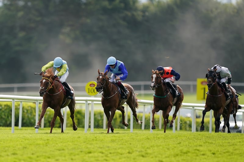 Hidden Land ridden by Jockey Luke McAteer (left) on their way to winning the Guinness 0.0 Handicap during day four of the Galway Races. Photograph: Brian Lawless/PA