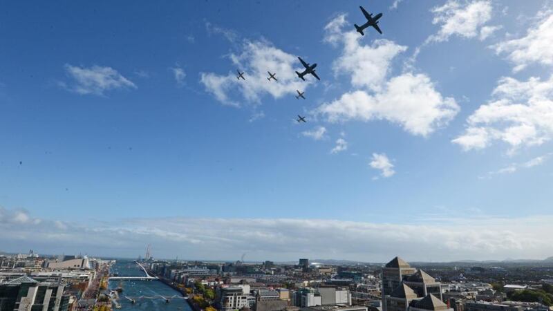 Two Aer Corps Casa escorted by four PC9 aircraft, flying over the river Liffey, at the FlightFest in Dublin today. Photograph: Eric Luke/The Irish Times