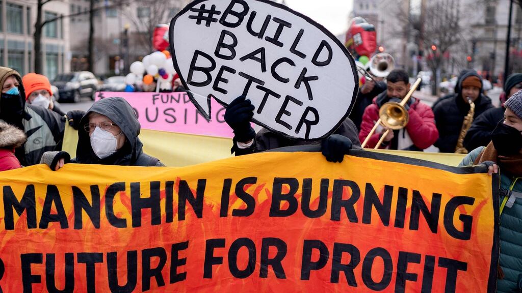 Activists in Washington DC campaign for the passing of Build Back Better legislation, which has been held up by the objections of Democratic senator Joe Manchin. Photograph: Stefani Reynolds/AFP
