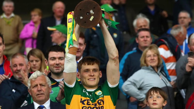 Kerry’s captain Gavin White lifts the trophy after winning the Munster football championhsip. Photograph: James Crombie/Inpho