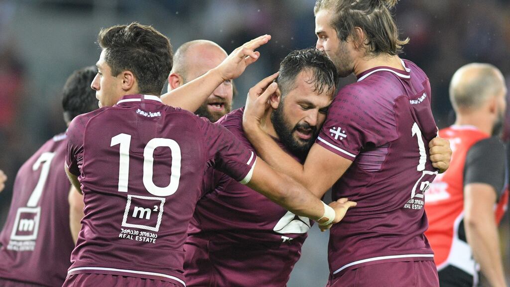 Tedo Abzhandadze, Karlen Asieshvili and Mirian Modebadze celebrate a try during their recent warm-up defeat to Scotland in Tbilisi. Photograph: Levan Verdzeuli/Getty