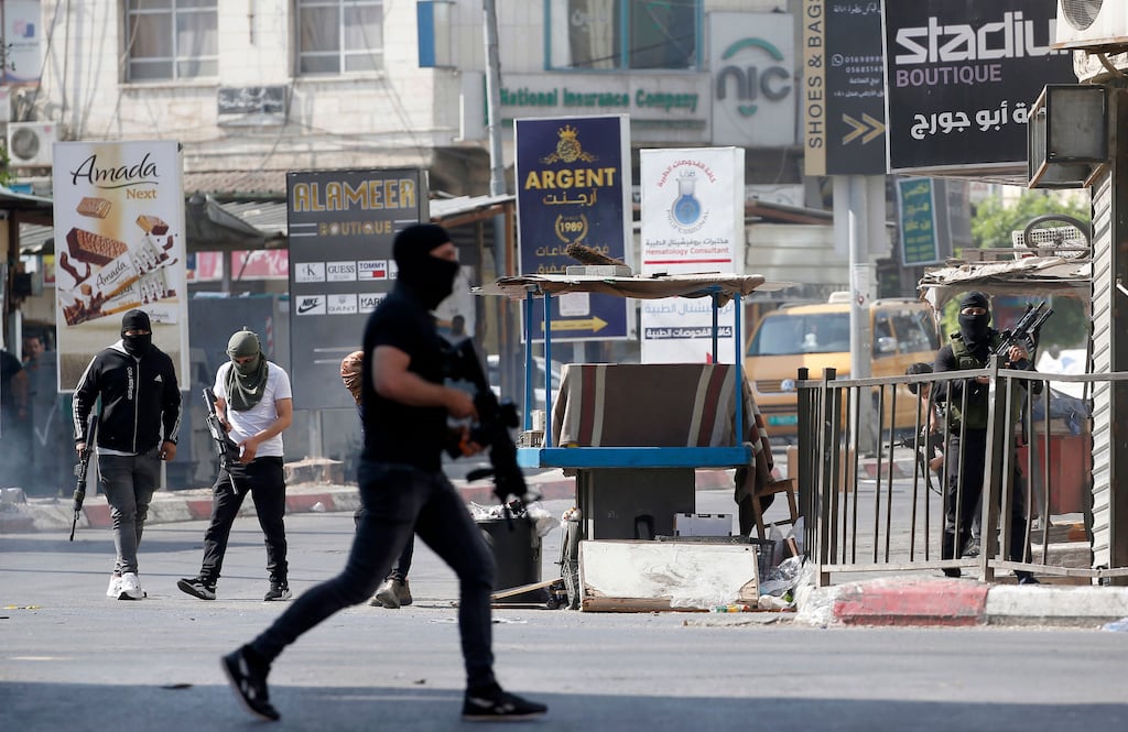 Palestinian militants in a firefight with the Israeli military in Jenin, the West Bank, on Monday. According to the Palestinian health ministry, at least nine people were killed and 27 were wounded in the Israeli military operation in Jenin. Photograph: EPA