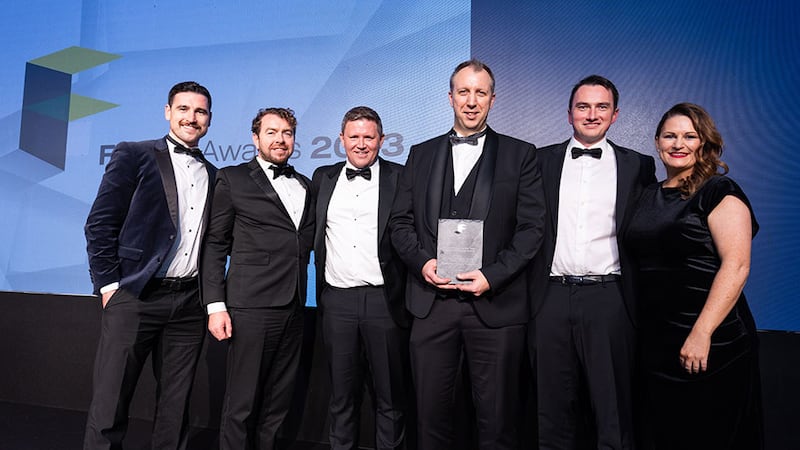 Mark Mulraney, managing director at Jan Janssens & Company, presents the fit out project of the year – small office over €500K of the year award to Millimetre Design team