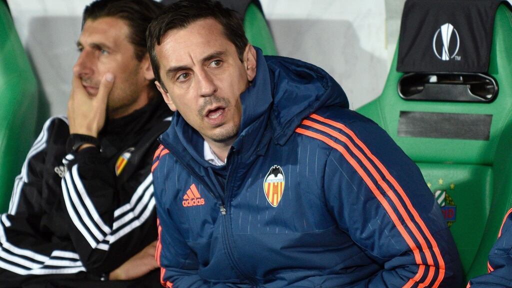 Valencia’s head coach Gary Neville watches his team ease by Rapid Vienna. Photograph: Getty Images