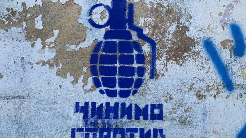 Graffiti reading ‘Let us resist’ near the school in Lviv where citizens are attending weapons training. Photograph: Lara Marlowe