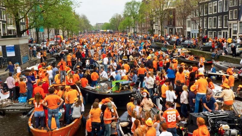 Thousands of boats circulate Amsterdam and provide music and entertainment for those partying on the surrounding streets.
