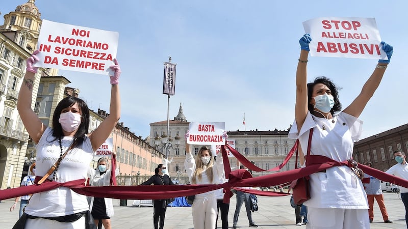 Beauticians and hairdressers in Turin call on the Italian Government to allow salons to reopen before June 1st. Photograph: Alessandro Di Marco/EPA