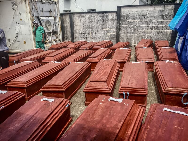 Coffins of the Sierra Leoneans killed during a protest in August are lined up in Freetown's central mortuary. Only four family members for each victim were allowed to be present. Photograph: Sally Hayden