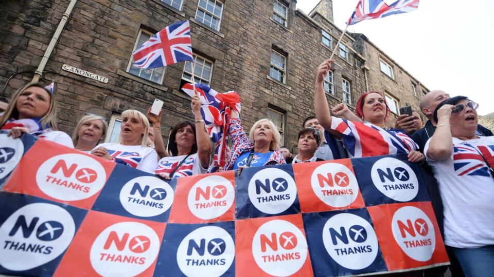 Opponents of a Scottish independence cheer as members of the Orange Order march  in Edinburgh. Photograph: Andy Rain/EPA